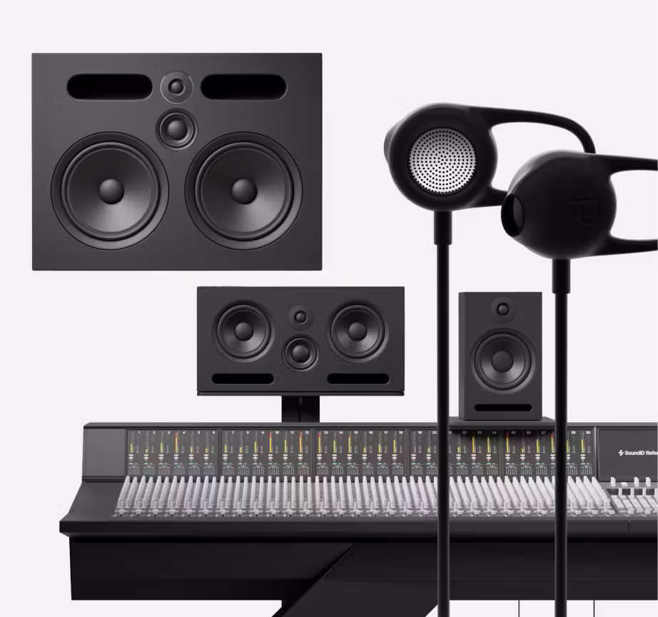 Black minimalist recording studio with large white monitor speakers and a professional mixing console viewed from the front.
