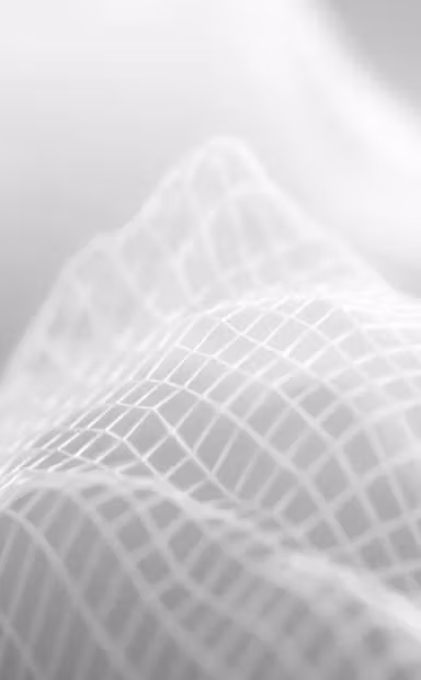 Soft abstract gray 3D wave mesh pattern with smooth gradients, used as a minimal background texture.