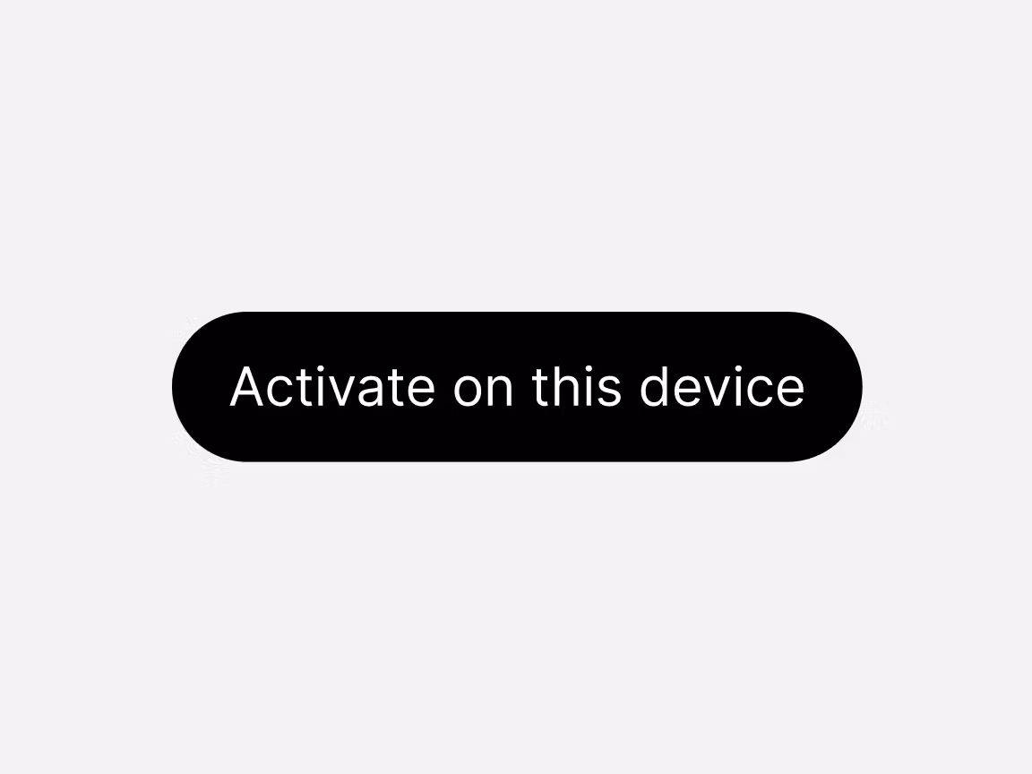 Rounded black call‑to‑action button with white text reading “Activate on this device,” displayed on a light user interface background.