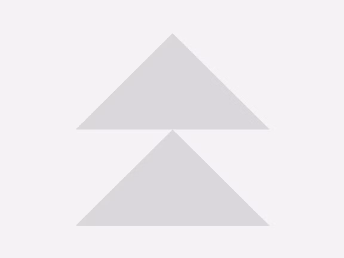 Minimal gray double‑triangle progress indicator aligned tip to tip on a light background, suggesting loading or processing state.