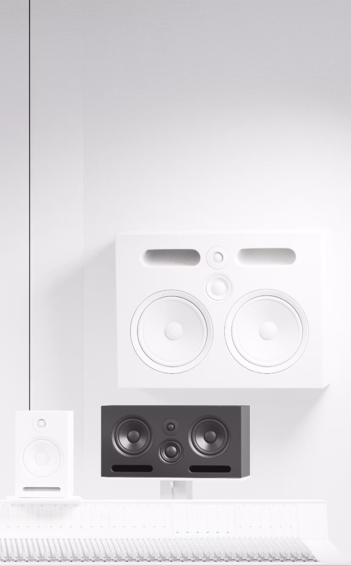 Modern studio control room with white wall-mounted monitors, a black center speaker, and a large white mixing console beneath.